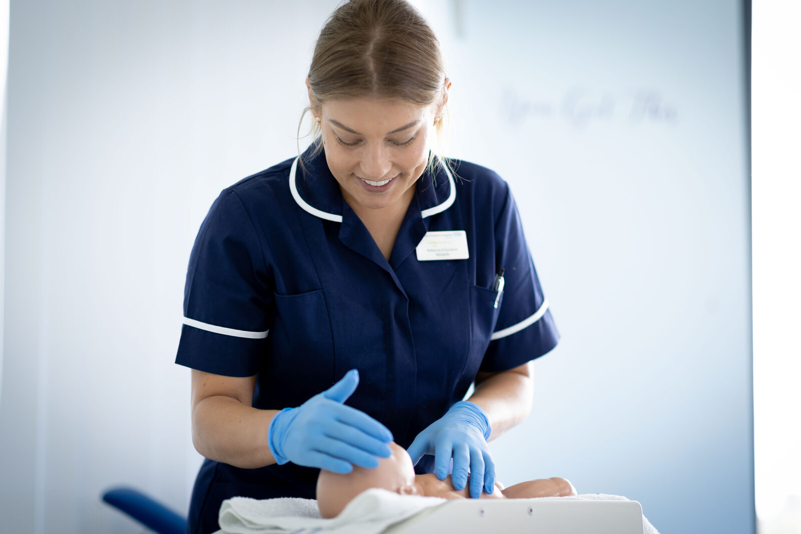 Midwife examining a newborn baby